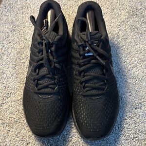 Sleek Black Athletic Shoes with Breathable Mesh and Padded Ankle Support